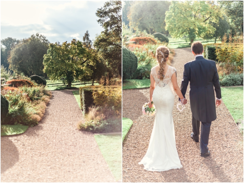 Iscoyd-park-country-house-wedding-photographer-Luxury-private-venue-with-bride-and-groom-walking-through-gardens