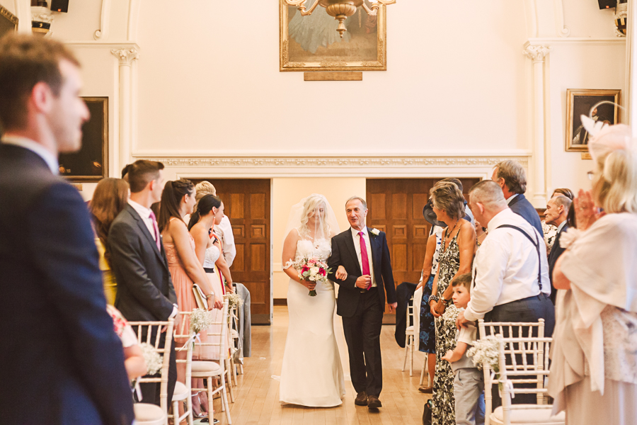 Winchester-guildhall-wedding-ceremony-father-and-bride-walking-down-aisle-winchester-wedding-photographer