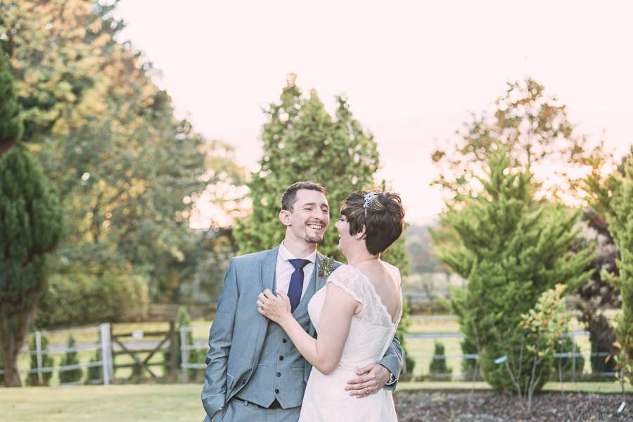 Highfield-hall-autumn-october-wedding-flintshire-wedding-photographer-bride-and-groom-in-natural-couple-hug