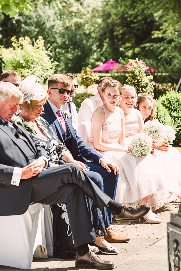 Outdoor-summer-wedding-ceremony-Warrington-Photographer-Statham-lodge-guests
