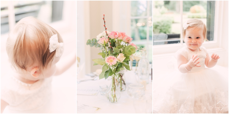 Girl-christening-details-bow-in-hair-roses-as-a-centrepiece-and-sat-on-window-seat-at-statham-lodge-lymm