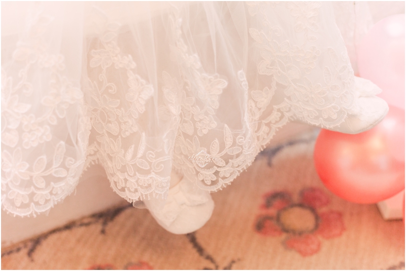 Christening-details-lace-traditional-dress-and-lace white-shoes-with-bow