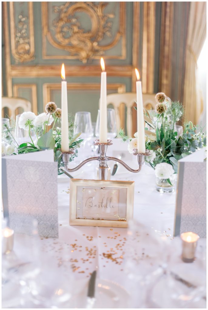 Luxury wedding table at Clivedon house decorated with  Candelabra & gold confetti 