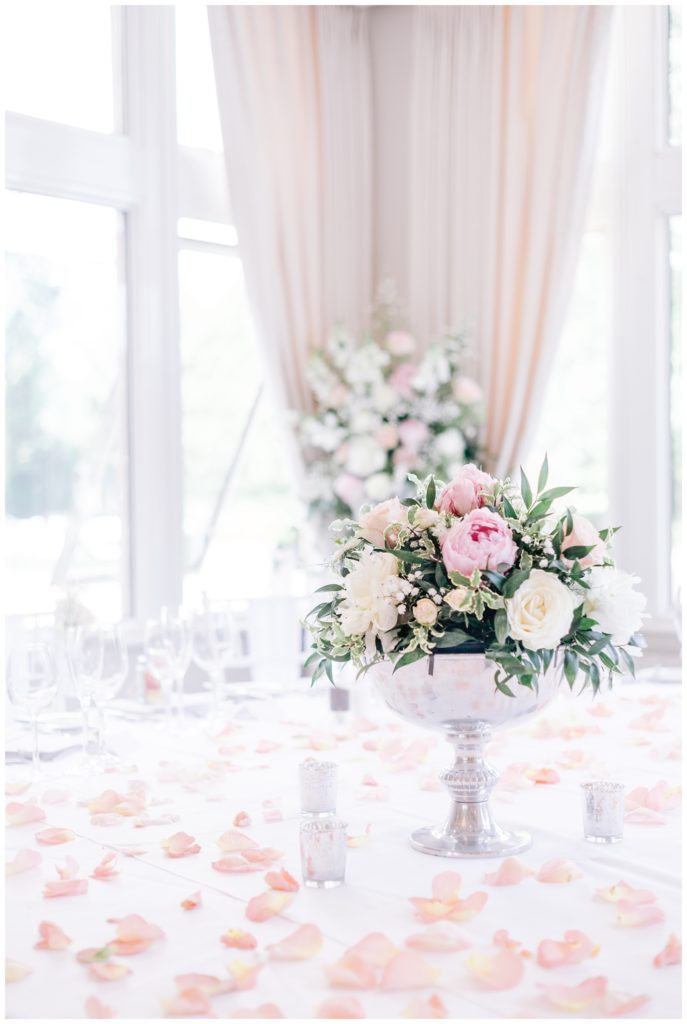 Hartsfield Manor Wedding tob table decorated in light pink rose petals
