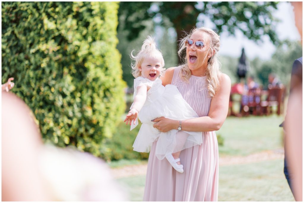 Beautiful Bridesmaid and Flower Girl having fun in the Garden at Hartsfield manor
