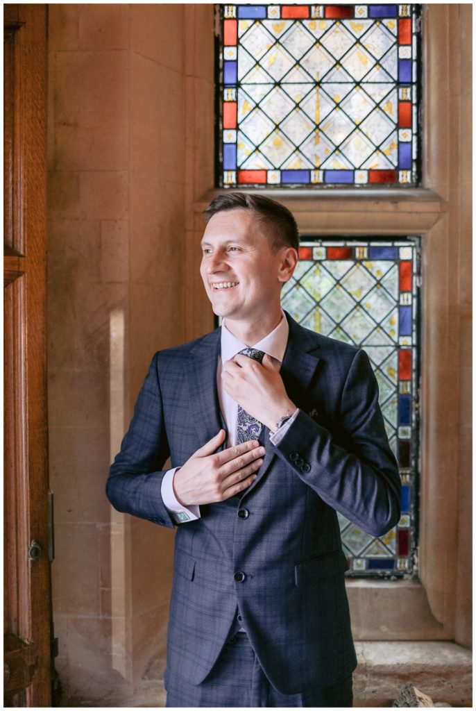 Groom portrait before the wedding ceremony in the foyer of Hartsfield manor